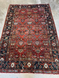 Full view of Northwest Persian Heriz rug showing linear rows of floral design.