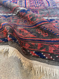 Edge detail highlighting handwoven construction and natural fringe.