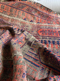 Folded view demonstrating floppy handle and supple wool