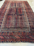 Antique Persian Baluch rug with vegetable dyed wool.