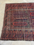 Nomadic pattern with intricate symbolic motifs.