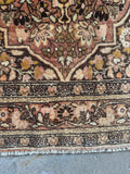 Dainty border bands framing the main field of the antique Persian Tabriz.