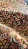 Apricot and peach hues creating a gentle palette in the Persian rug.