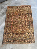 Full view of the antique Persian Tabriz rug showing balanced proportions.