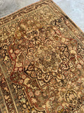 Close-up of medallion within medallion pattern on antique Haji Jalili Tabriz rug.