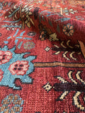 Early 1900s Persian Heriz displaying marbling effect from natural dyes.