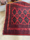 Traditional Afghan craftsmanship displayed through intricate border details.