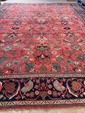 Grand-scale antique Persian rug suitable for a spacious living room or dining area.
