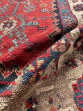 Close-up of vegetable dyed wool and low pile texture on 19th century Caucasian runner.