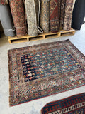 Antique Caucasian rug woven with vegetable dyed wool showing rich abrash and lively tribal pattern.