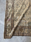 Corner detail showing faded blues and intricate motifs.