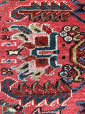 Heriz rug close up showing vibrant color palette and texture.