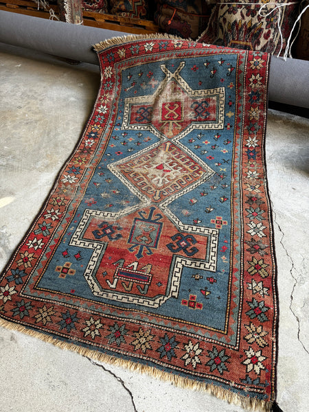 Antique 1900s Caucasian rug with French blue field and three medallions.