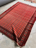 1920s antique Persian rug with red candy stripe ribbon design.