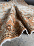 Large vintage Persian Tabriz rug with floral motifs and an ornate border band.