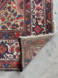 1920s Persian rug with strong construction and tight weave.