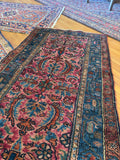 Vintage Persian Malayer rug with low pile and moody pink and blue color palette.