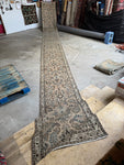 Ultra skinny antique Persian runner with botanical motifs.