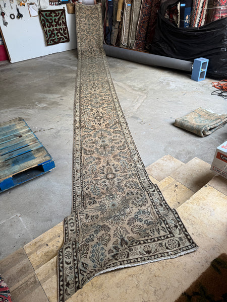 Ultra skinny antique Persian runner with botanical motifs.