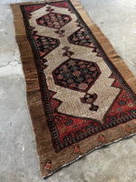 Antique 1920s Persian runner with double medallion design.