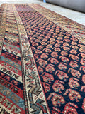 Hand knotted 1920s tribal runner rug ideal for high traffic entryways and hallways.