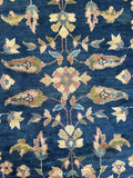 Navy blue antique Turkish Sparta rug with scrolling vines and spacious open field design.