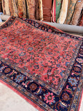Antique Persian Mahal rug 9x12 featuring an all-over floral pattern on a soft antique salmon ground.