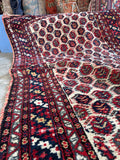 Soft wool antique Persian rug measuring 3 foot 9 inches by 6 foot 2 inches.