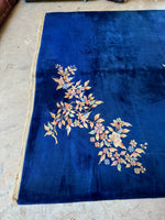 Plush wool Art Deco Chinese rug with two-dimensional floral corner motifs.