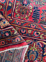 Vintage handwoven rug with floral details