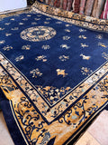 Extra large Antique Chinese Peking rug displaying blue and gold color story and decorative design.