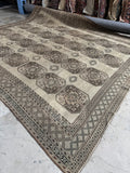 Vintage Shiraz area rug with low pile, secured edges, and an effortless neutral palette.