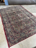 1880s antique Persian Lavar Kerman rug with sand ground and floral motifs.