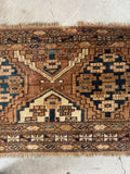 Nomadic Turkoman rug 1x4 top-down view highlighting soft wool pile, rich natural dyes, and fringe detail.