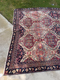 7'6 x 10' antique Persian rug from Kerman with a finely woven lattice design, botanical motifs and an ivory ground.