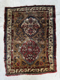 Antique Caucasian rug with camel ground and two geometric medallions