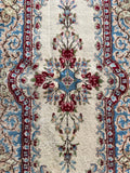 2x4 hand-knotted Persian rug with a classic Kerman floral pattern.