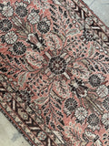 Long Persian runner from the 1930s with floral and paisley motifs.
