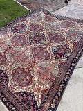 Antique Kerman Lavar rug 7'6 x 10' hand knotted in Persia with an intricate lattice pattern and large interconnected medallions.