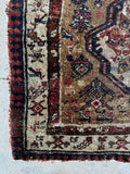 antique Caucasian scatter rug with tribal motifs