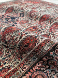 Hand-knotted Persian Ferahan rug with repeating paisley design