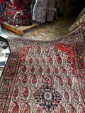 Antique Persian scatter rug with geometric medallion and floral motifs