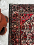 Worn low-pile Persian rug with stout and solid construction