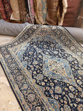 Vintage Persian Kashan rug in navy and powder blue with detailed floral pattern.