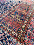 4x8 antique Persian Bidjar rug with colorful horizontal geometric bands.