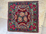 Decorative floral vintage persian rug on a stone floor