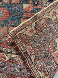 5x6 early 1900s Persian tribal area rug, underside view.