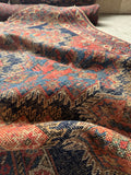 5x6 antique Persian Afshar rug with coral, ivory, and indigo geometric tribal design.