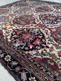 1880s Persian Kerman Lavar rug with an ivory ground, berry red, rust, taupe, sky blue and midnight blue vegetable dyes.