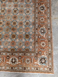 Corner detail of an antique Persian Tabriz rug with secured edges, low wool pile, and beautifully aged patina.